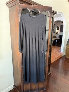Pomander place black knit dress with pearl sleeve closure